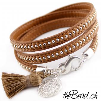 Leather bracelet with tassel and silver pendant