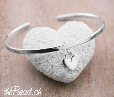 silver bracelet with heart pendant