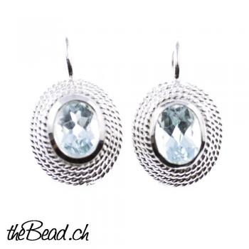 Earrings with blue topaz