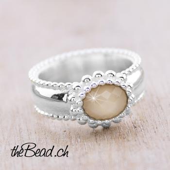 Finger ring with orange moonstone