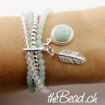 feather and silver pendant bracelet