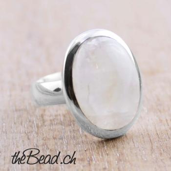 women silver finger ring made of 925 sterling silver and rainbow moonstone