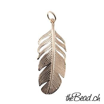 Feather pendant in gold