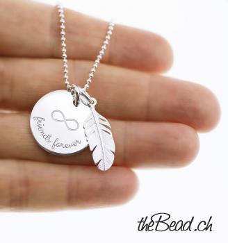 silver necklace with engraved pendant