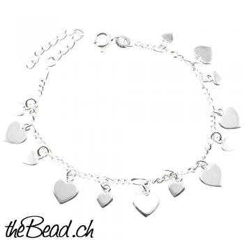 Silver bracelet with heart pendants