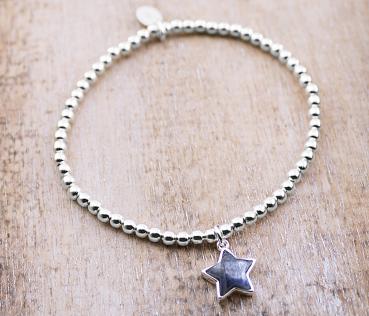 silver bracelet with kyanite star pendant