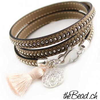 Leather bracelet with tassel and silver pendant