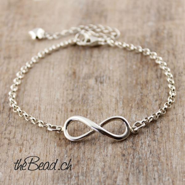 silver infinity bracelet with heart charm