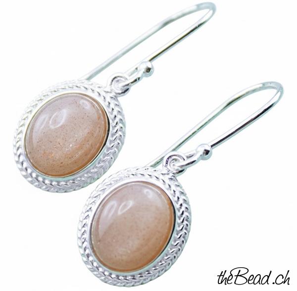silberschmuck ohrringe aus orangem Mondstein und silber